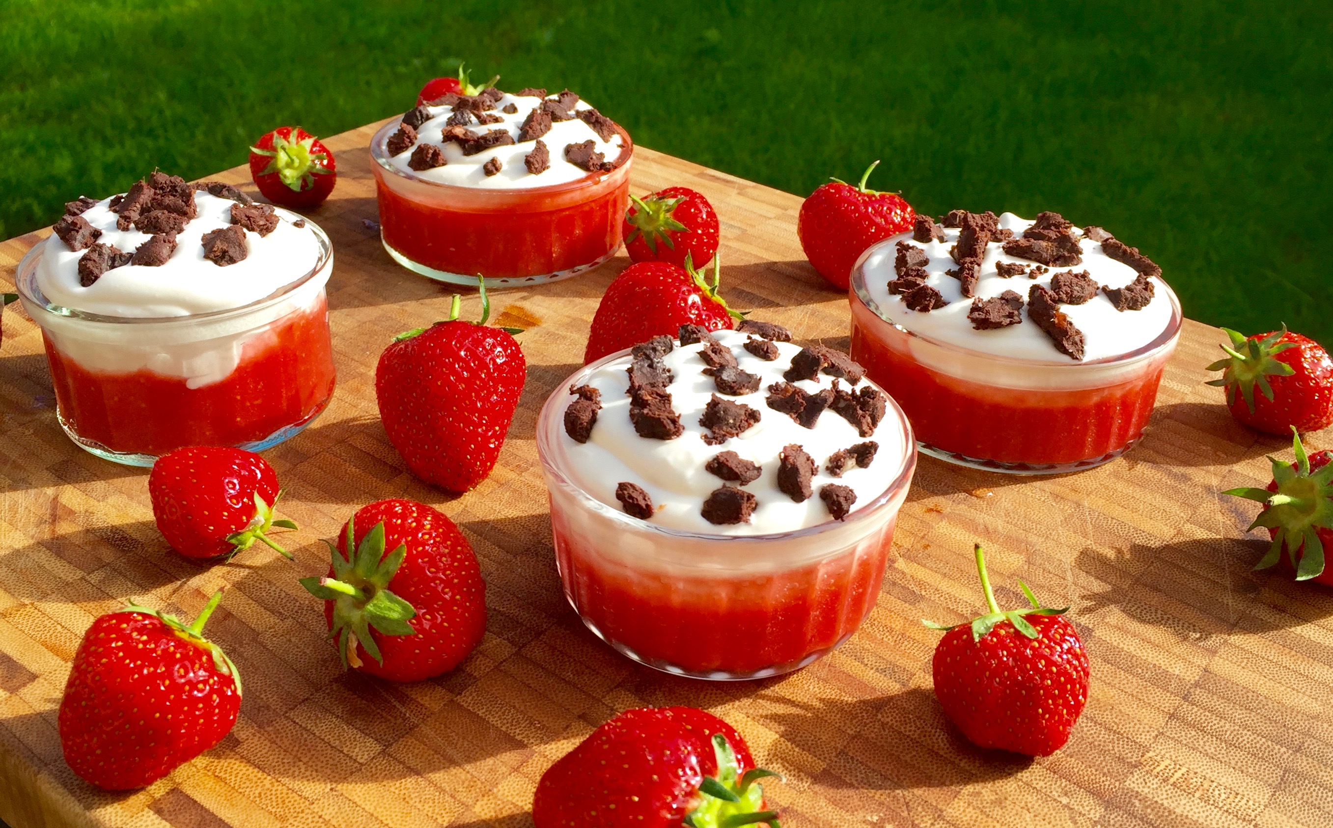 Coconut cream coated strawberries sprinkled with chocolate with dates